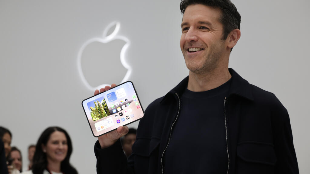 John Ternus holding iphone duo